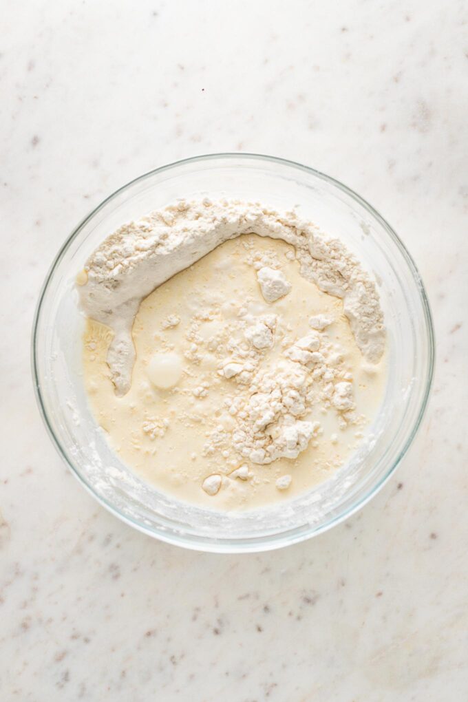 Liquid ingredients combined with dry ingredients.