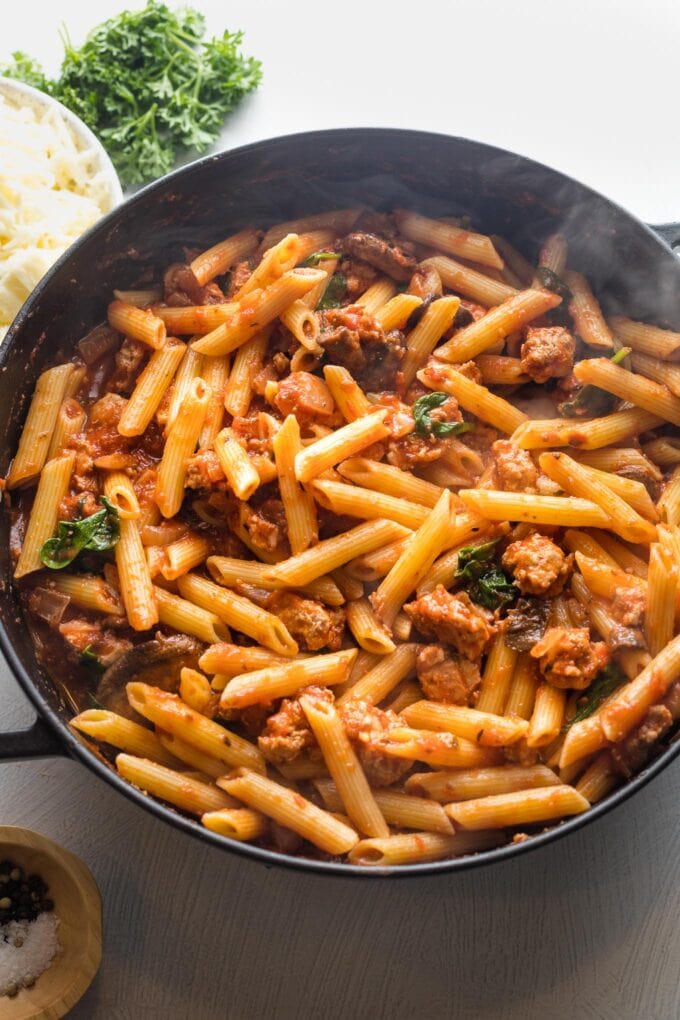 Pasta added to tomato sauce.