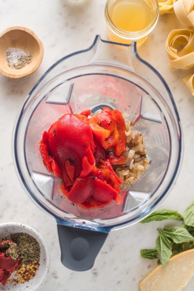 Shallots, garlic, and red peppers whole in a blender.