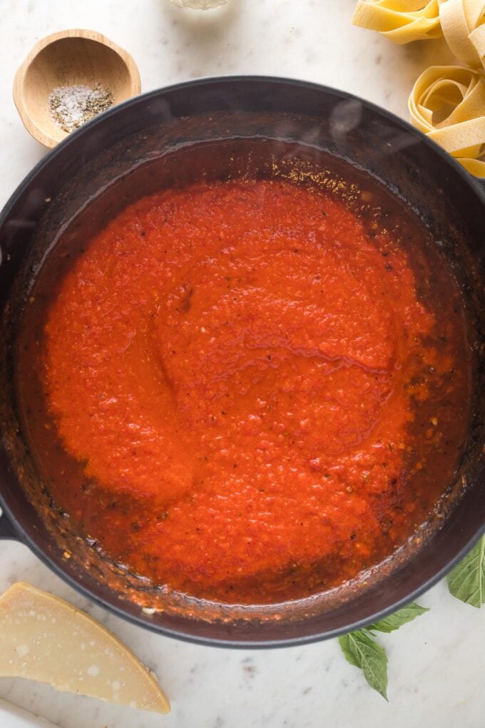 Red pepper sauce poured into skillet.