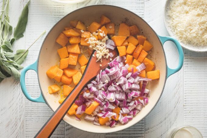 Red onion and garlic added to skillet.