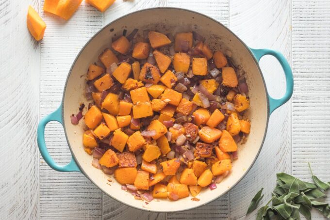 Butternut squash with red onion, cooked until tender.