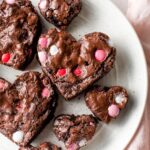 Close up view of a fudgy, heart-shaped brownie.