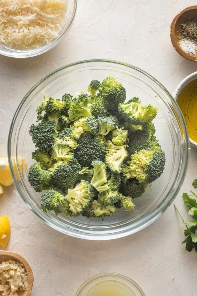 Broccoli florets in a prep bowl, chopped into small pieces.