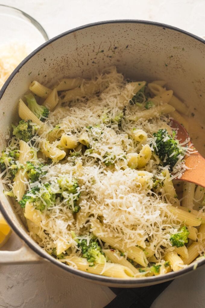 Lemon broccoli pasta topped with Parmesan cheese.