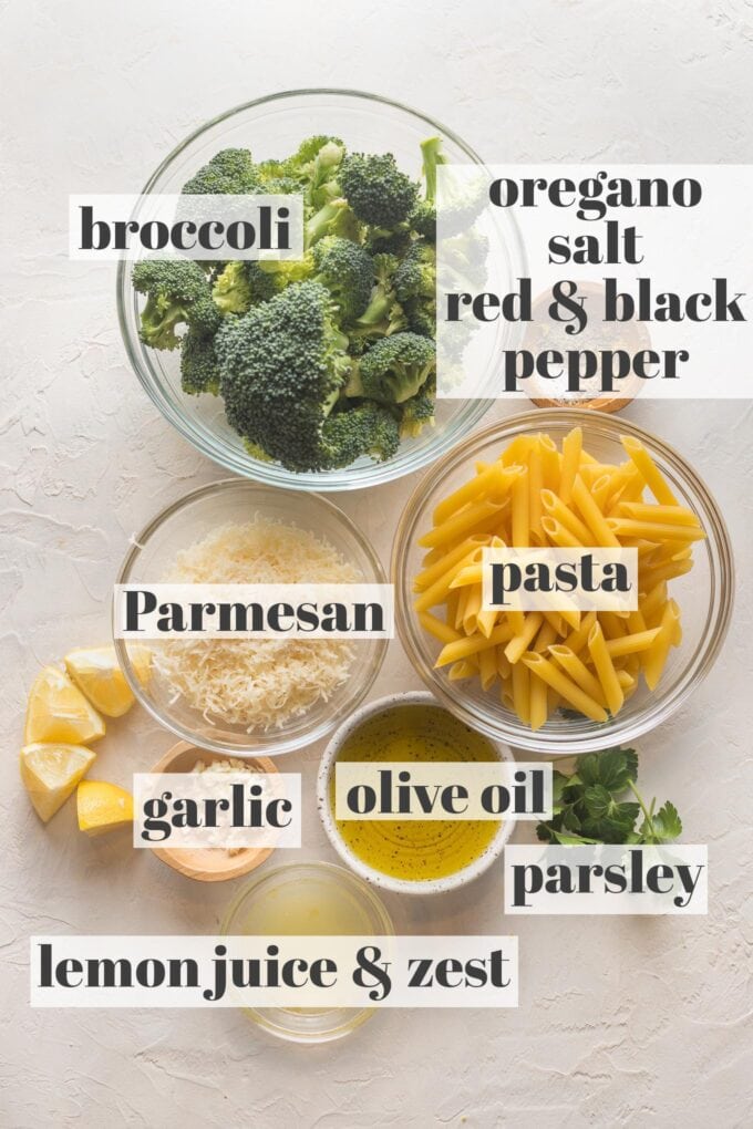 Labeled photo with prep bowls holding broccoli florets, pasta, Parmesan, olive oil, lemon zest and juice, parsley, olive oil, garlic and spices.