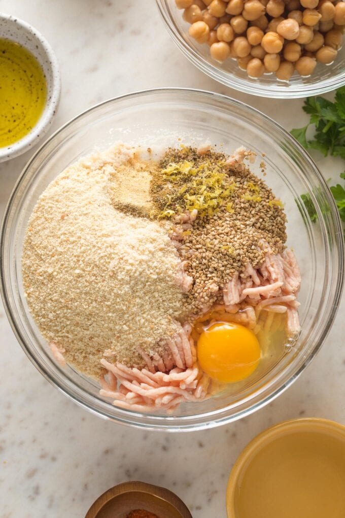 A prep bowl with all meatball ingredients, ready to be mixed together.