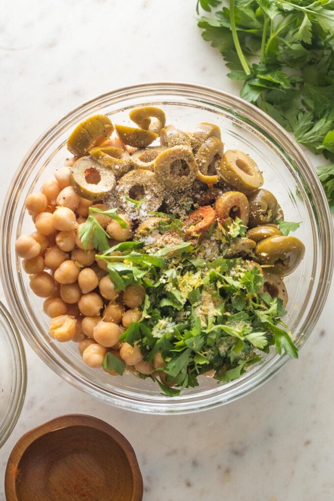 Chickpea salad ingredients combined in a prep bowl.