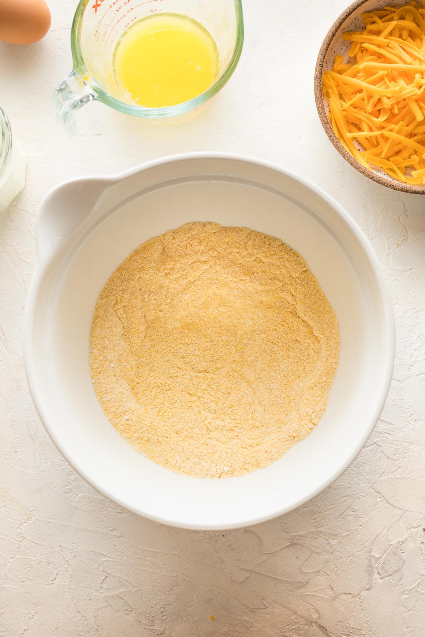 Dry ingredients in a white mixing bowl.