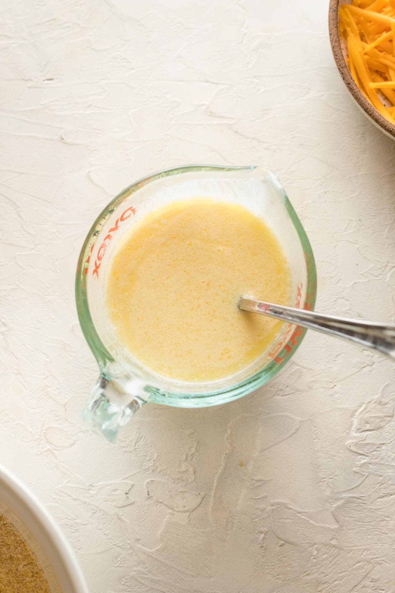 Liquid ingredients in a measuring cup.