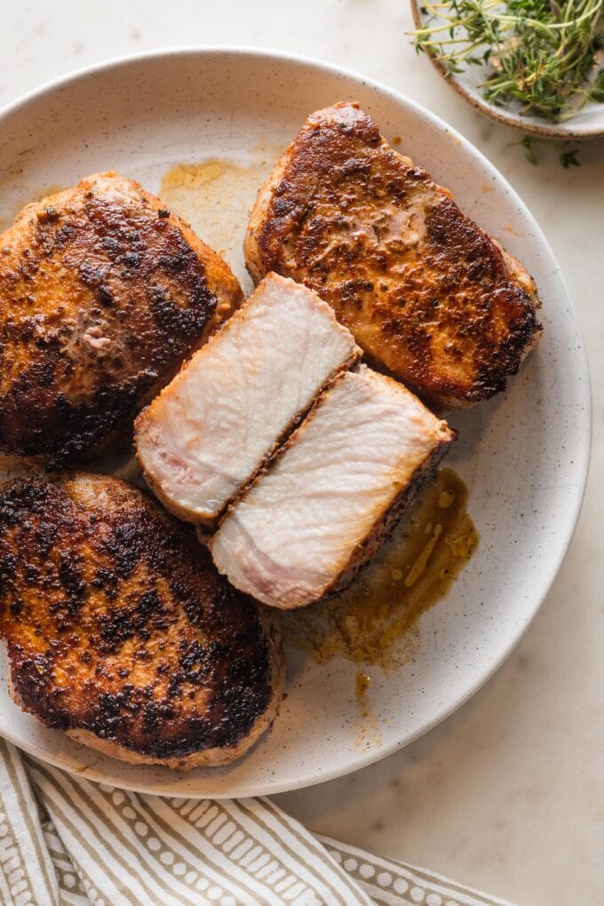 Pork chop cut open to reveal the tender, juicy interior.