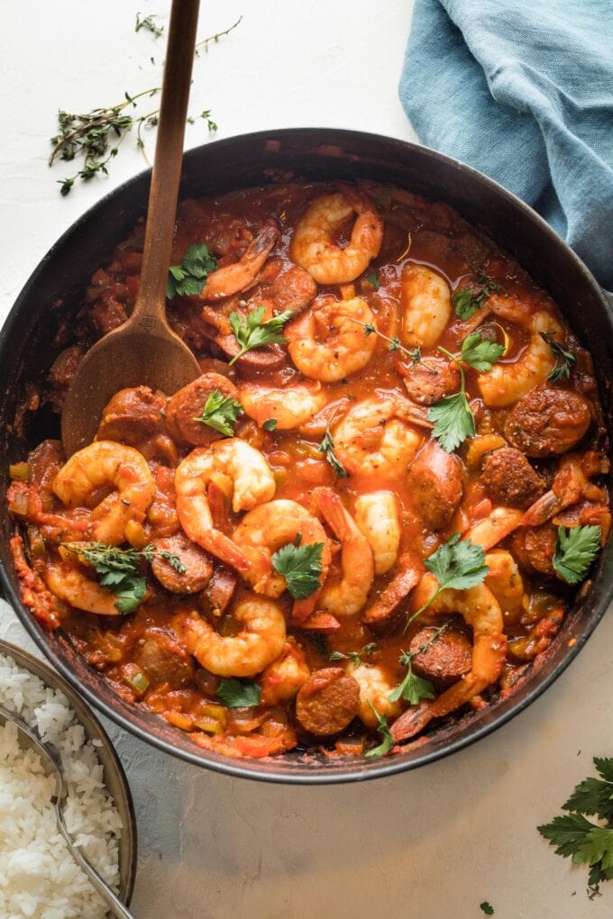 Shrimp and sausage jambalaya without rice in a large cast iron skillet, ready to serve.