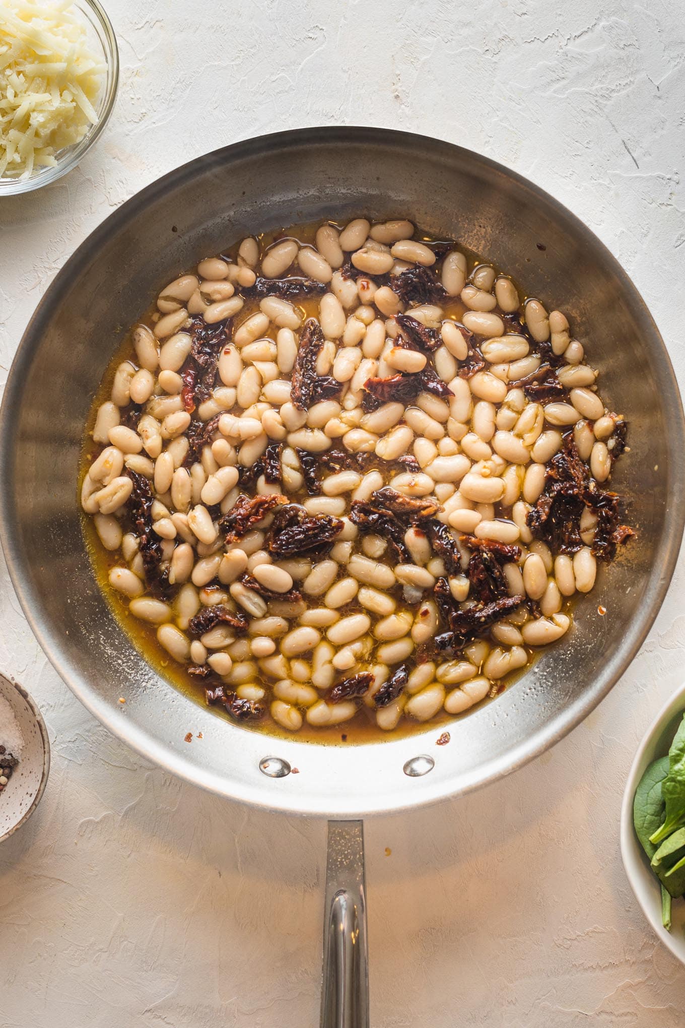 Beans added to skillet.