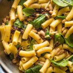 Skillet filled with a Tuscan-inspired pasta with Cannellini beans.