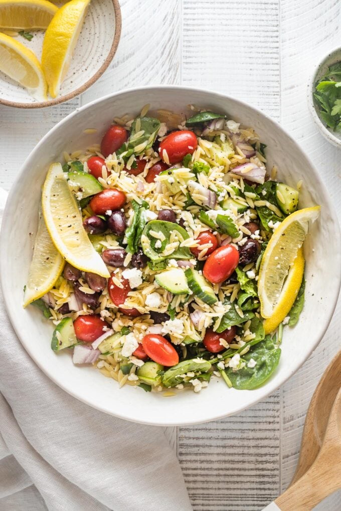 Bowl with a large lemon orzo salad ready to serve.