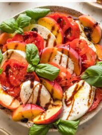 Add stone fruit for a sweet summery twist on a classic: this juicy, sunset-hued Peach Caprese Salad is a gorgeous side, snack, or light meal for the warmest days of the year. Fresh basil leaves and a drizzle of rich balsamic glaze tie it all together with no fuss.