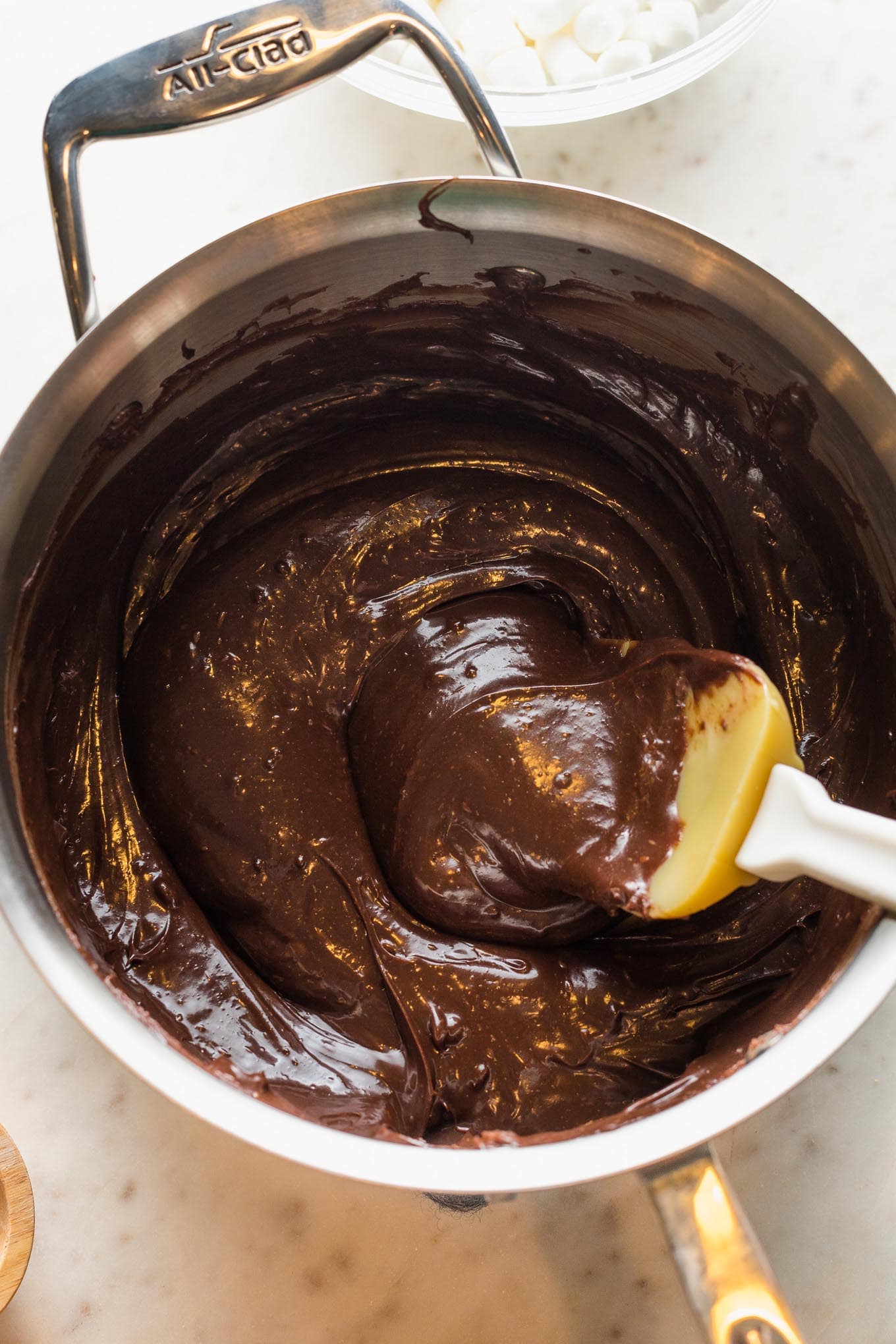 Melted chocolate in a saucepan.