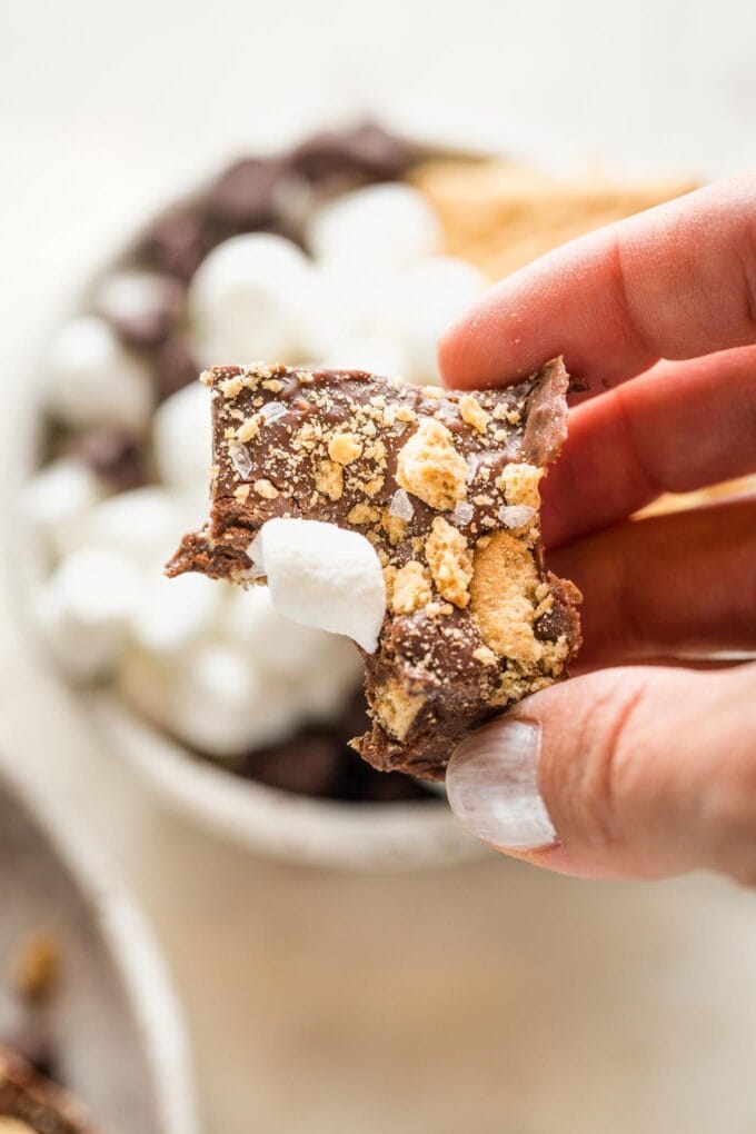 Close up of a piece of s'mores fudge with one bite taken out.