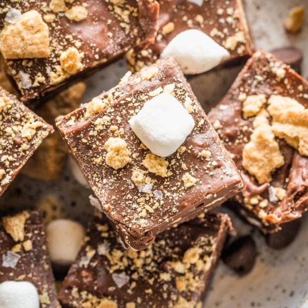 Close up of flaky sea salt topping a S'mores-flavored piece of fudge.