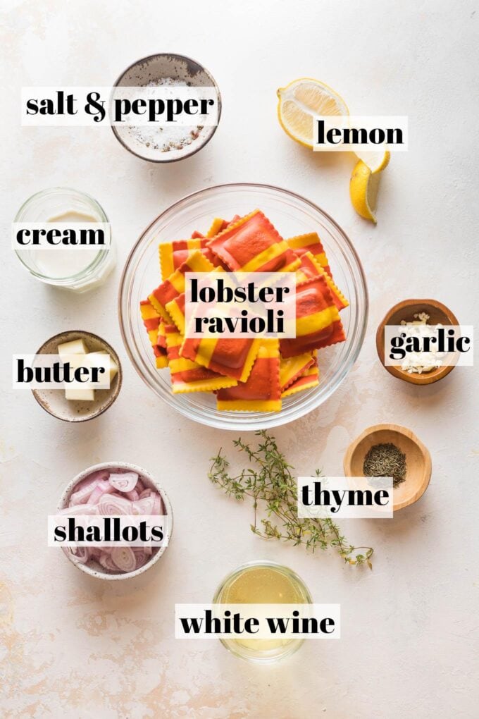 Prep bowls with labels showing lobster ravioli and the ingredients needed to make an appropriate cream sauce (cream, white wine, thyme, lemon, shallot, garlic).