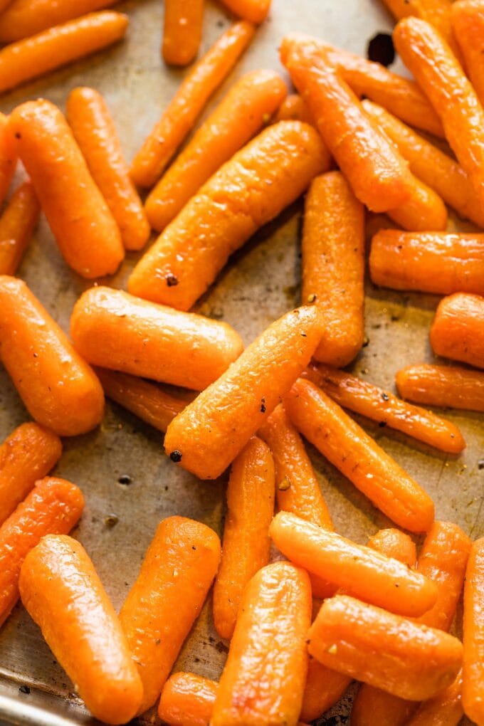 Close up of a roasted baby cut carrot.