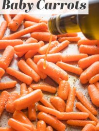 Roasted Baby Carrots are one of the easiest and tastiest side dishes you can make! Five minutes of prep and then they roast away to tender, sweet perfection, ready to serve alongside any meal. Keep it super simple with just olive oil, salt, and pepper, or dress things up with some of the tasty additions suggested below.