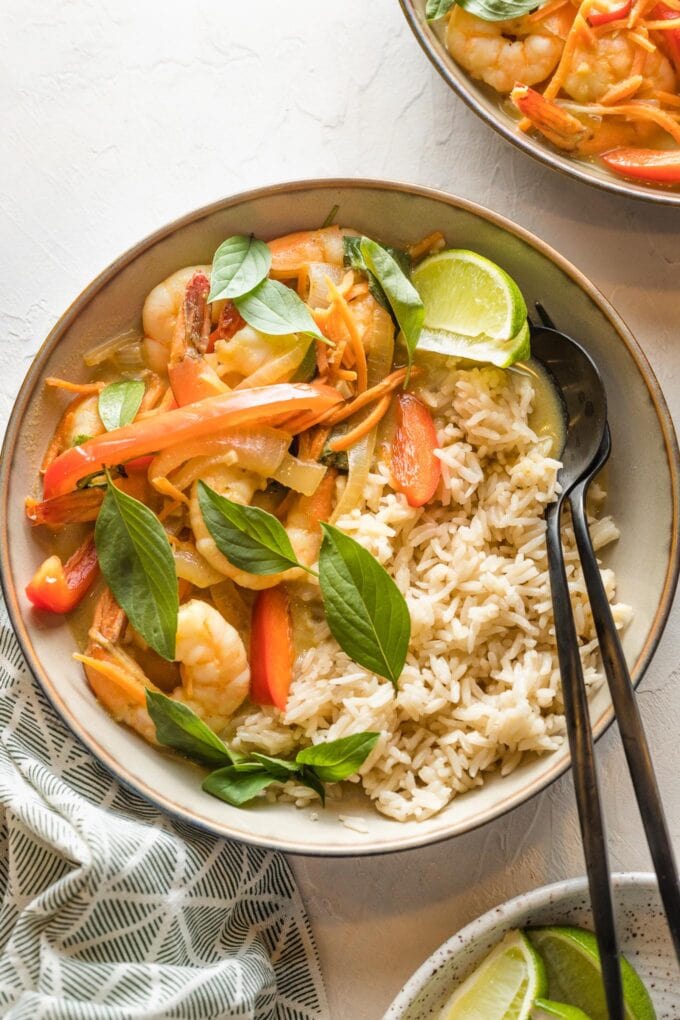 Bowl of Thai green curry with veggies and shrimp served over rice.