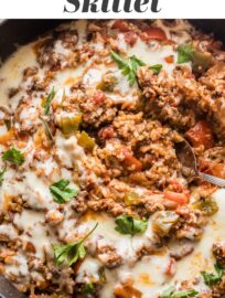 This easy ground beef Stuffed Pepper Skillet has all the cozy flavors of traditional stuffed peppers -- tender rice, healthy veggies, and creamy mozzarella -- but made in one pan in about 30 minutes. Weeknight dinner perfection!