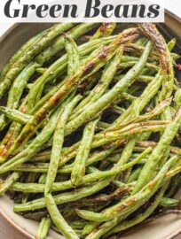 Roasted garlic green beans are the ultimate easy side dish when you need something hands off but full of flavor. Five minutes to prep, 20 minutes to roast, and so delicious you just may find yourself sneaking a few before they hit the dinner table.