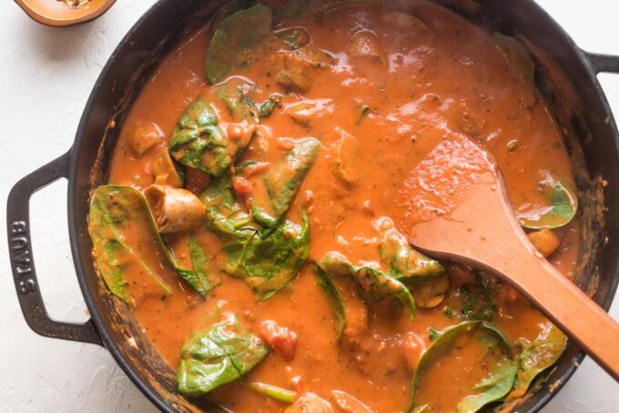 Spinach wilted in a creamy marinara sauce.