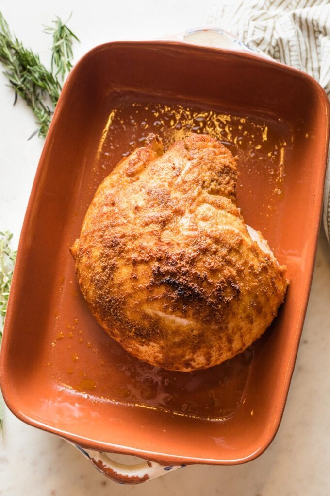 Turkey breast in a baking pan to broil.