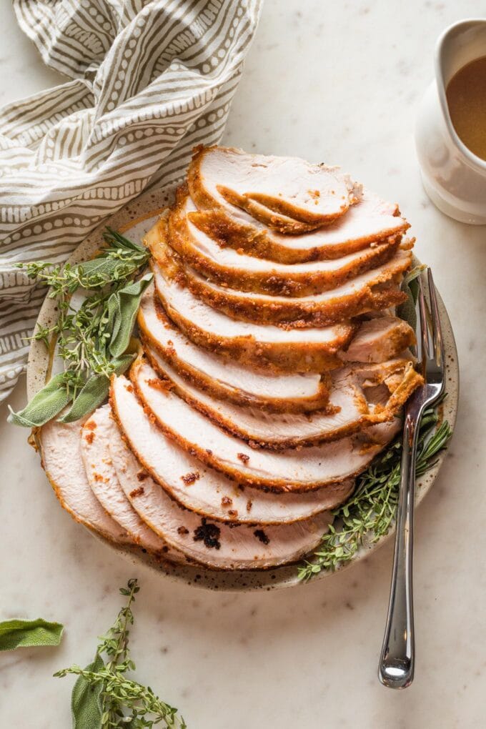 Plate with sliced turkey breast.