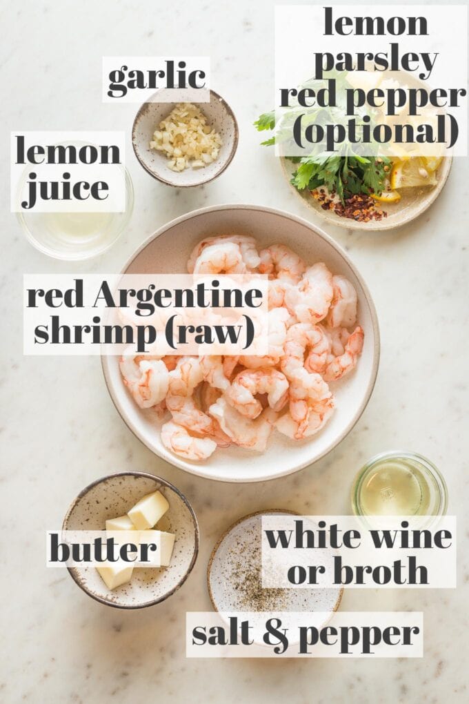 Prep bowls filled with raw red Argentinian shrimp, lemon juice, garlic, butter, white wine, salt, and pepper.