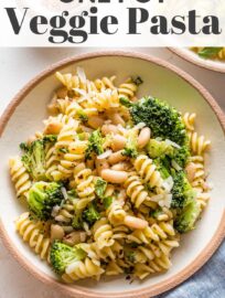 Pasta with White Beans and Broccoli is an easy dinner that packs veggies and a light plant protein all in one bowl. A quick braise of the beans in Mediterranean-inspired spices, together with a healthy sprinkle of Parmesan and lemon, makes for a flavorful one-pot meal.