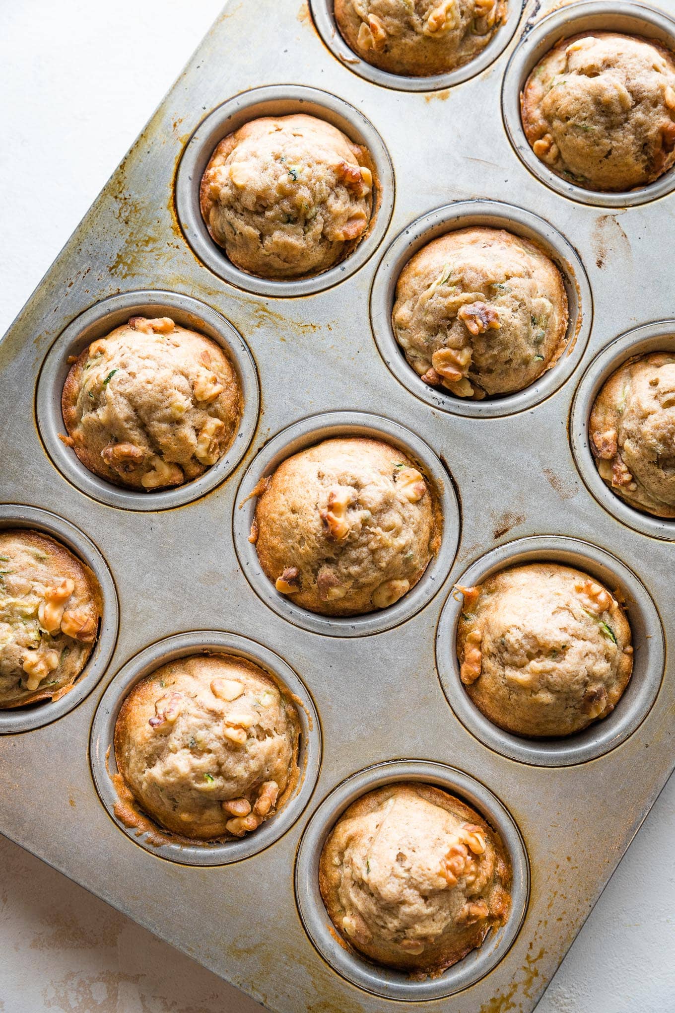 Just baked banana zucchini muffins, still in the muffin pan to cool.