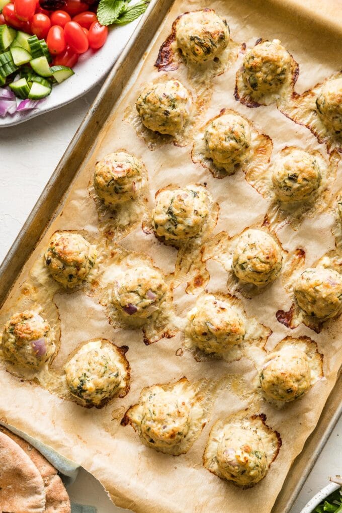 Baked Greek chicken meatballs just pulled out of the oven.