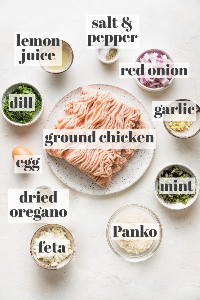 Labeled photo of prep bowls holding ground chicken, lemon juice, mint, dill, oregano, salt and pepper, red onion, garlic, feta, and Panko.