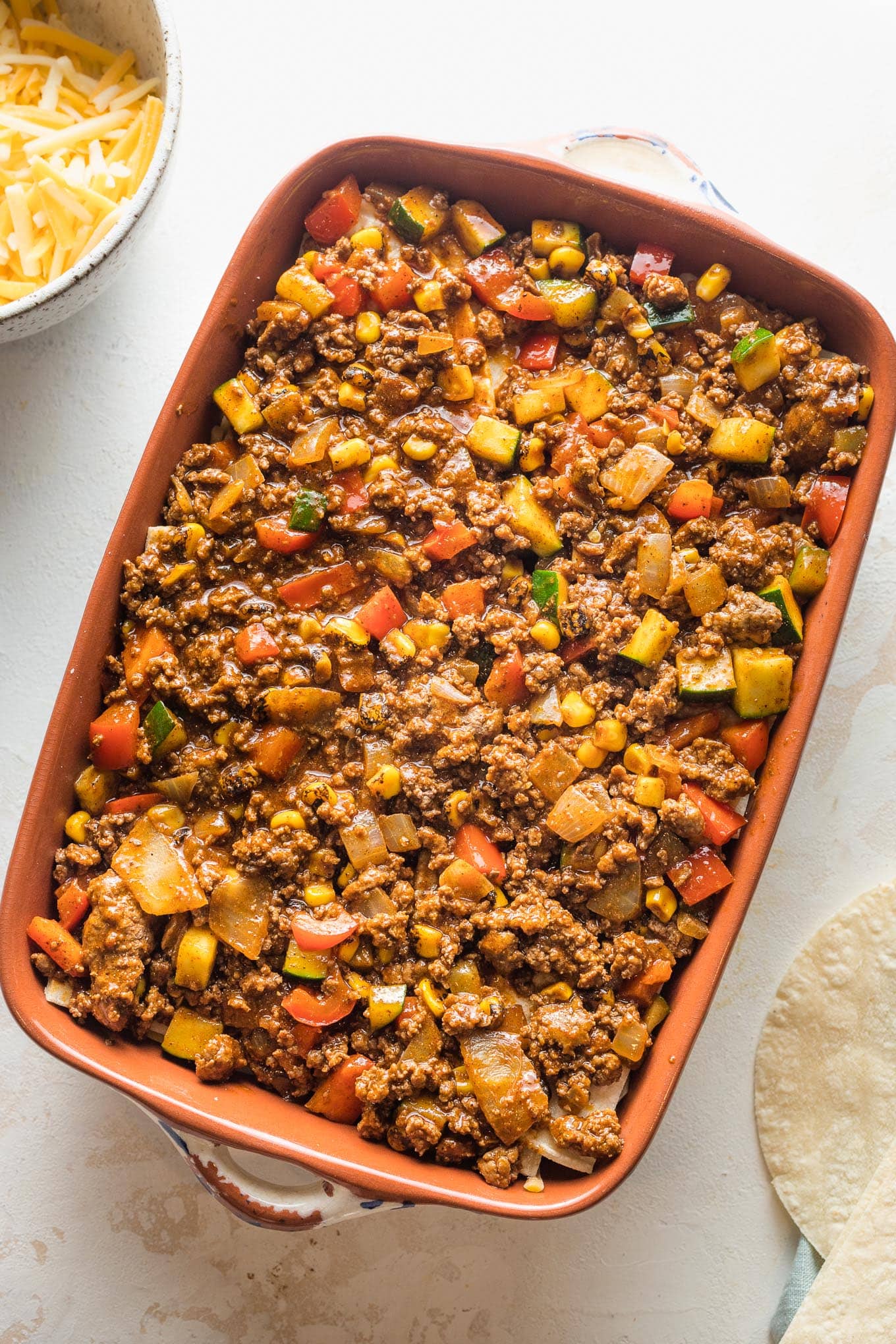 Another layer of tortillas and enchilada filling.