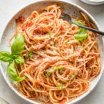 Small bowl filled with a large serving of pasta Napoletana.