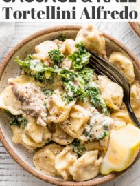 This recipe for Sausage Tortellini Alfredo is pure comfort food: creamy, delicious, and so easy to make. It's ready in about 30 minutes and has incredible flavor thanks to Italian sausage, tender cheese tortellini, and a smidge of fresh kale and lemon.