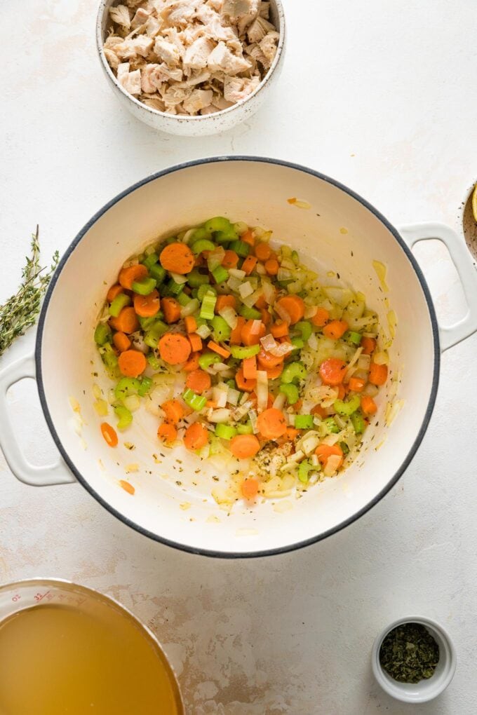 Carrots, celery, and onion sauteed together in a Dutch oven.