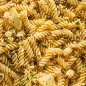 Rotini in a light lemon butter garlic sauce with capers and parsley.