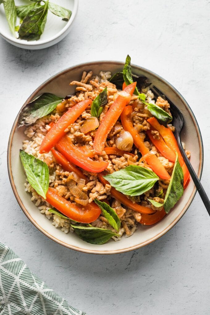 Bowl of Thai sweet basil chicken served over brown rice.