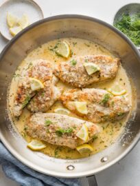 Overhead image of a skillet filled with creamy lemon chicken.