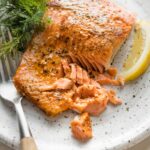 Close up image of flaky salmon cooked from a cold start in a 400 degree oven.