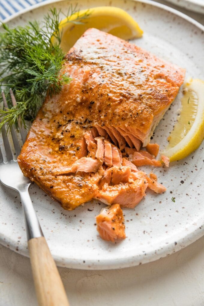 Close up image of flaky salmon cooked from a cold start in a 400 degree oven.