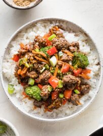 Bowl of teriyaki ground beef with vegetables served over white rice.