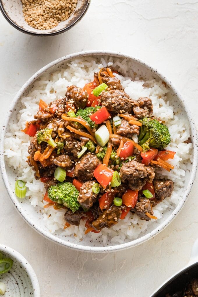 Bowl of teriyaki ground beef with vegetables served over white rice.