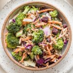 Small bowl filled with a serving of broccoli salad.