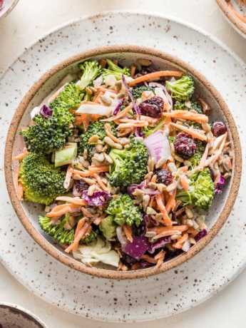 Small bowl filled with a serving of broccoli salad.